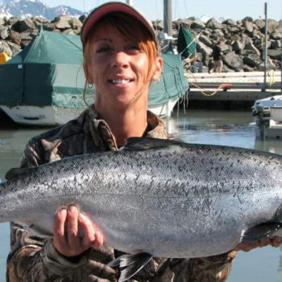 a man holding a fish